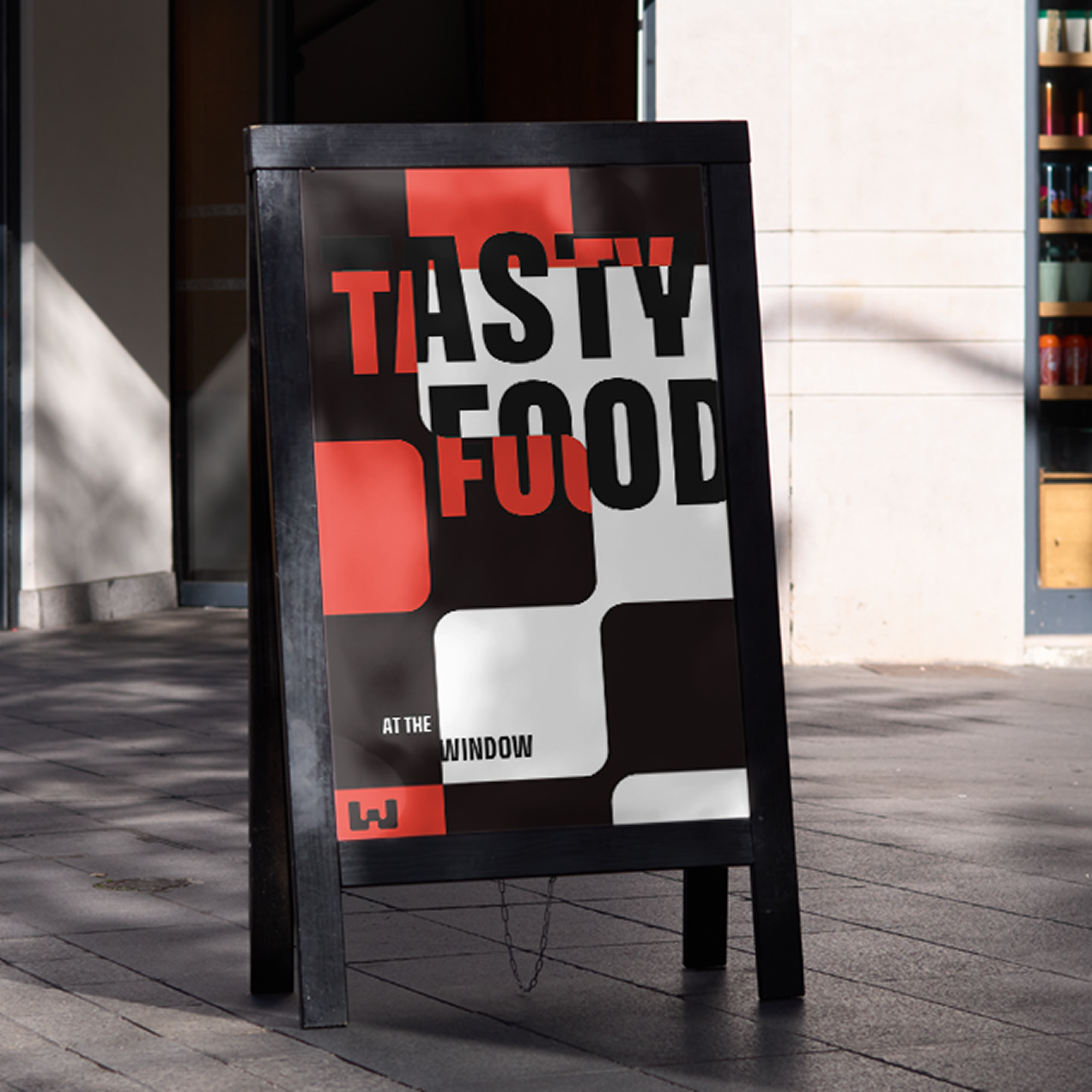 A frame sign stating: Tasty food at the window.